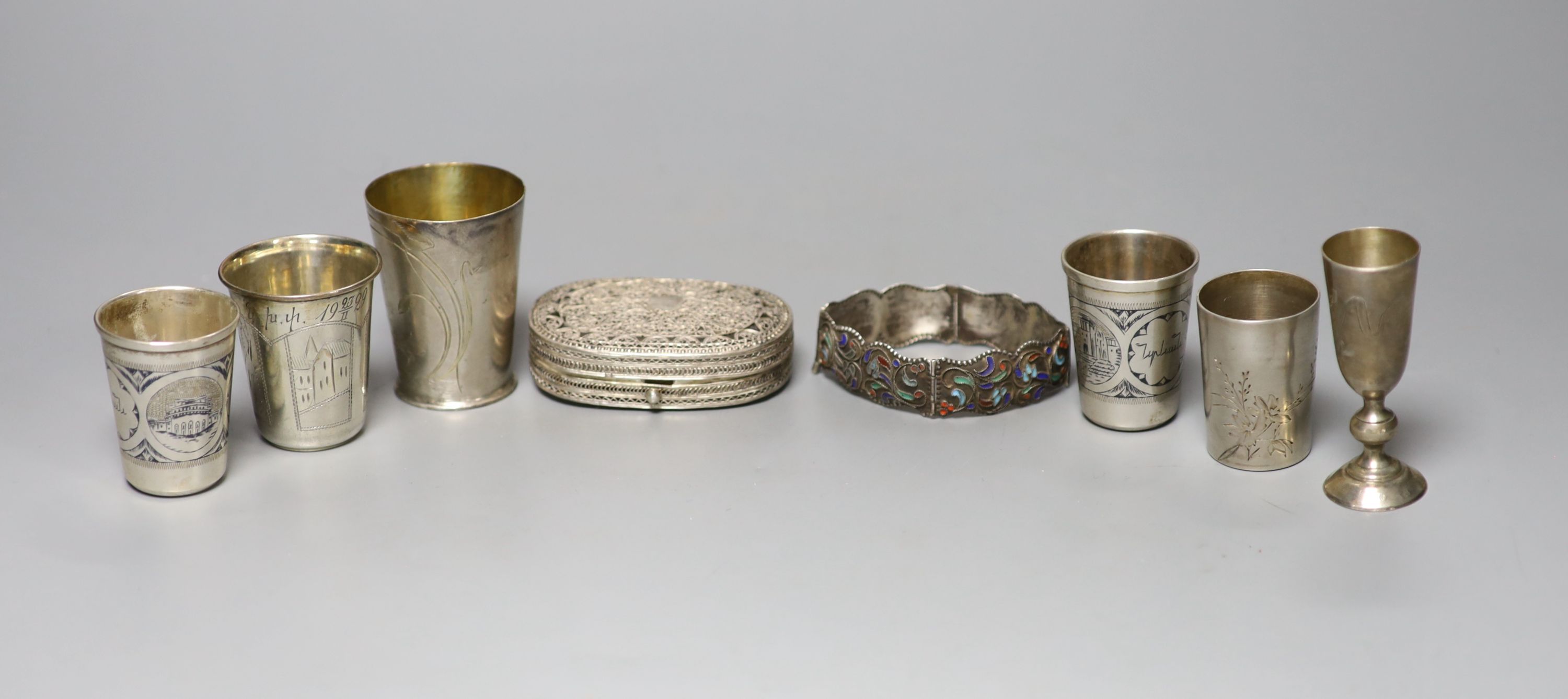 Six assorted early 20th century Russian 84 zolotnik tots, tallest 74mm, a similar enamelled bracelet and a filligree box